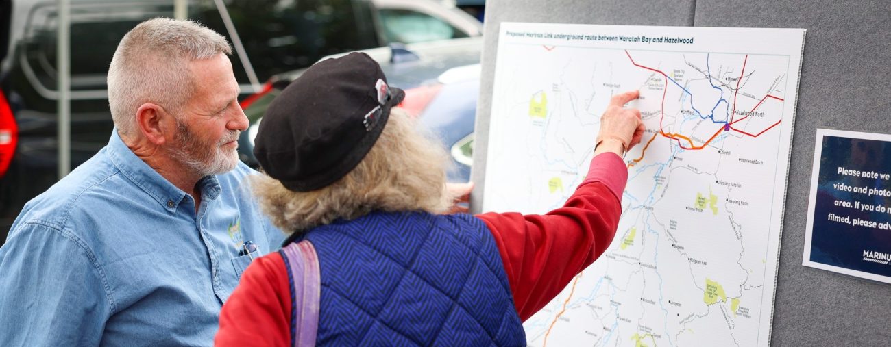 public event talking with a local about Marinus Link's alignment